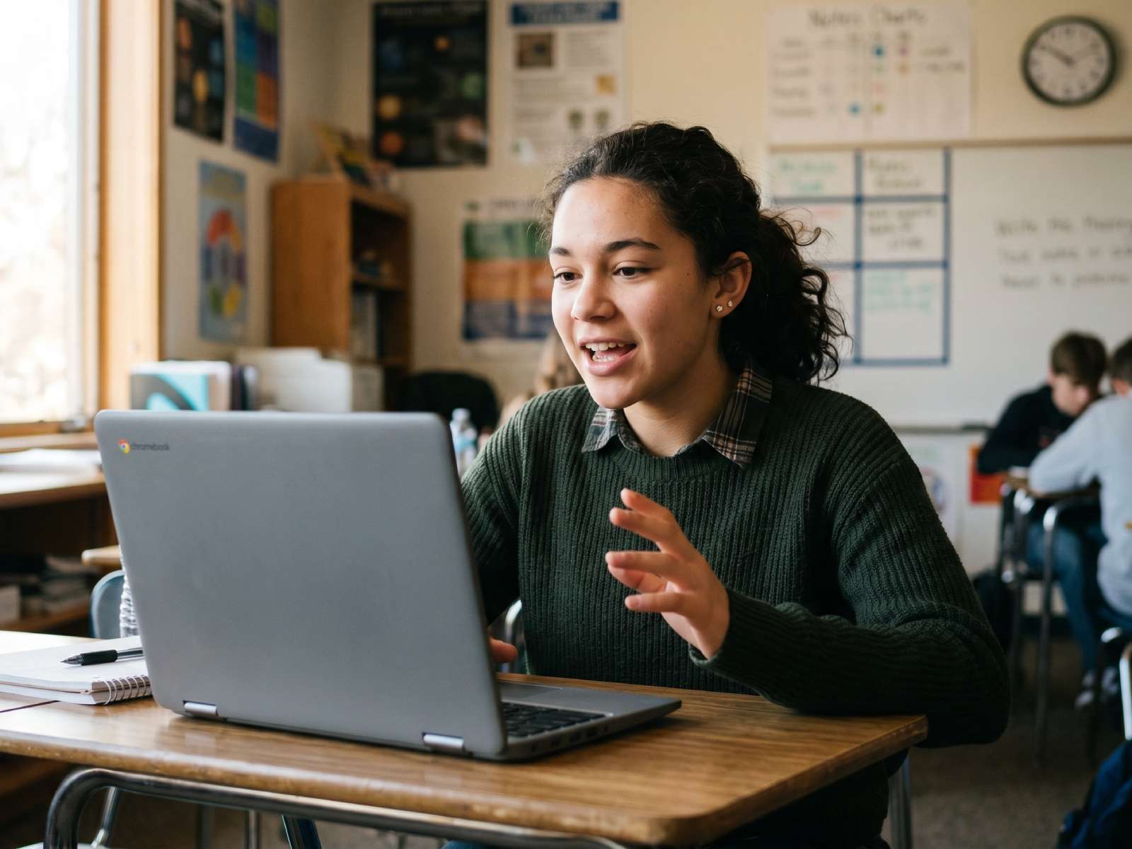 A student records a five-minute presentation in Fishbole, with their Google Slides beside a camera preview